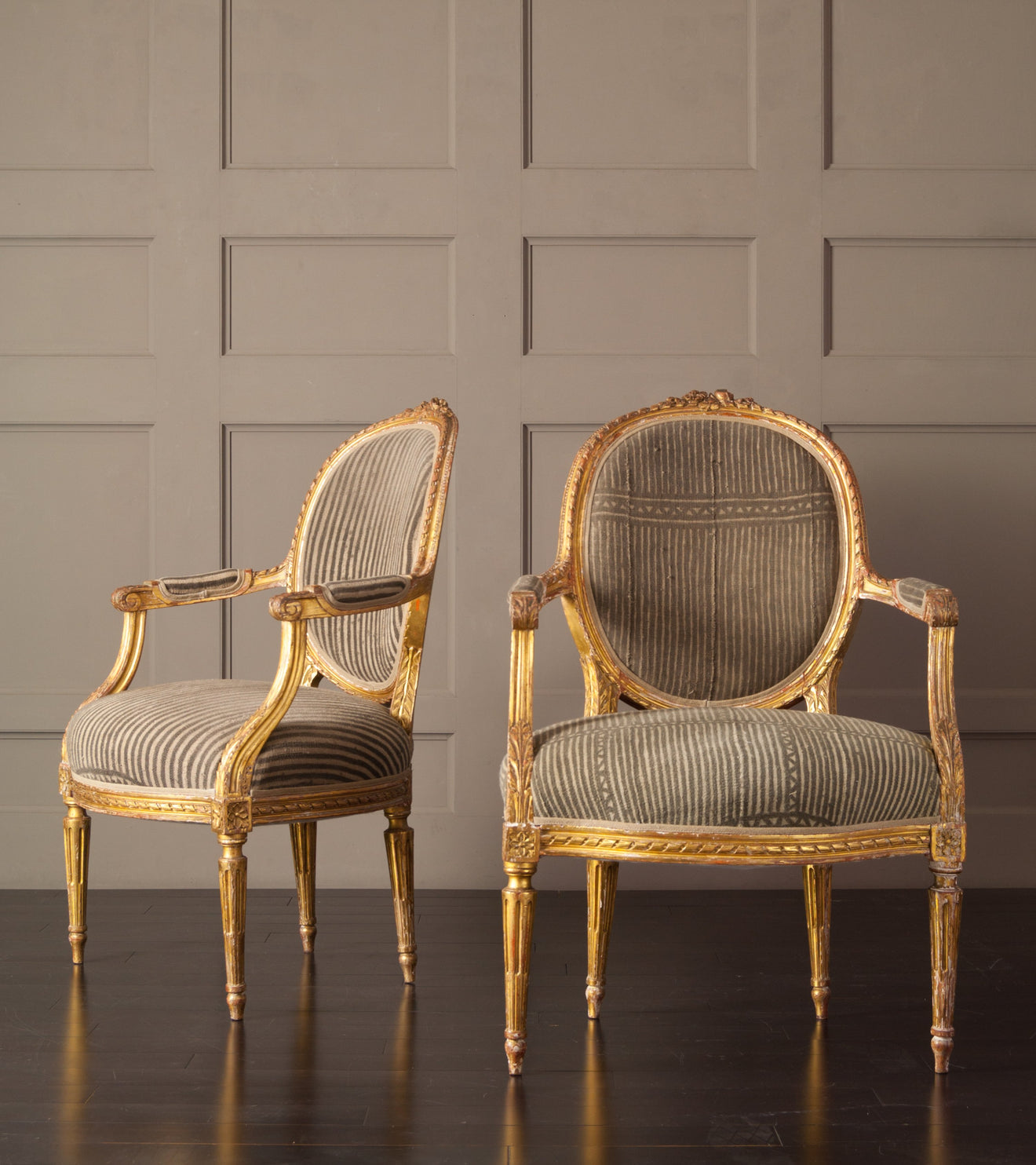 Pair of Louis the XVI Carved and Gilded Chairs with Antique African upholstery