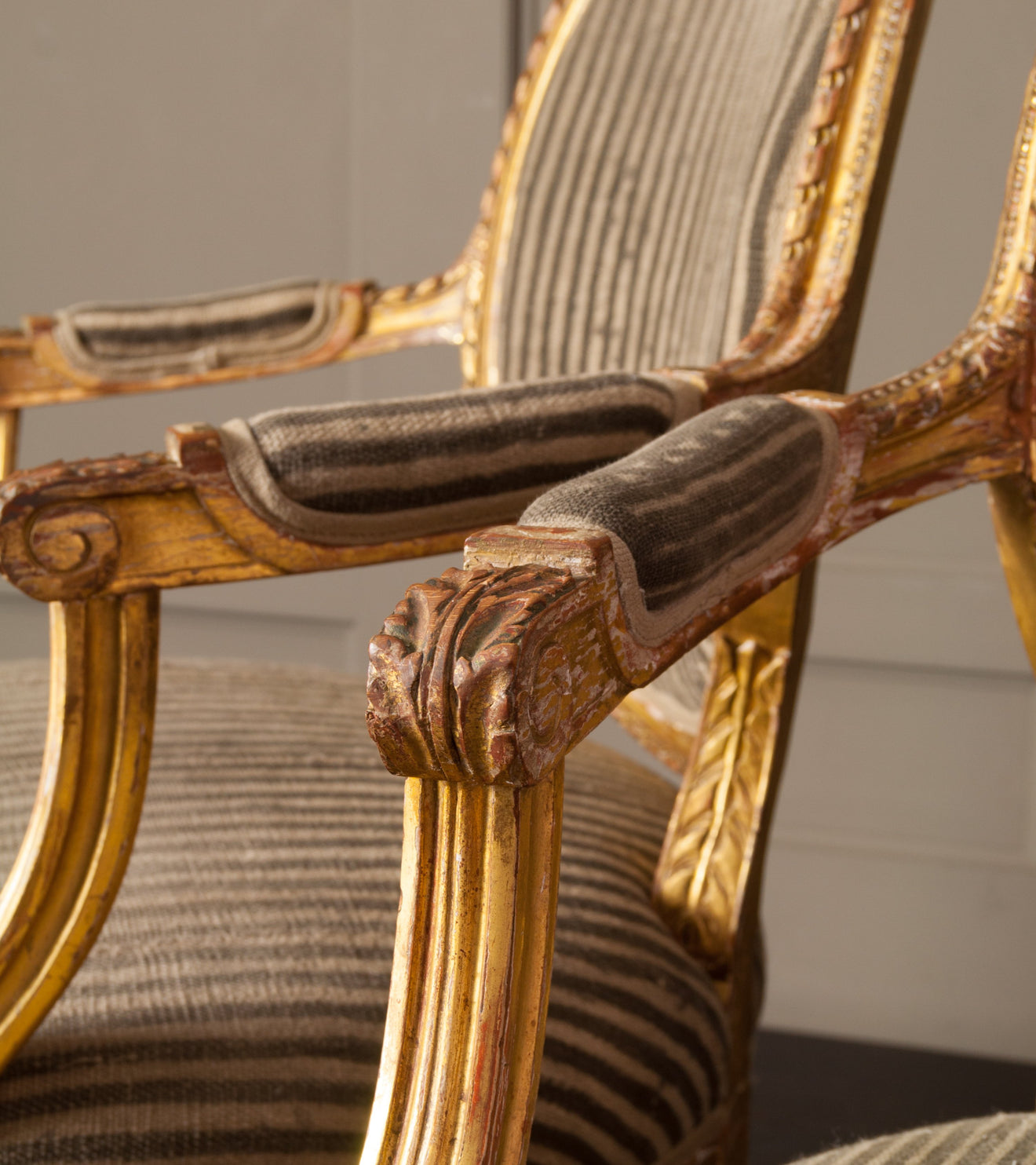 Pair of Louis the XVI Carved and Gilded Chairs with Antique African upholstery